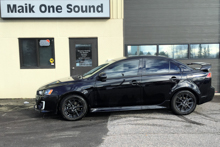 Black 2017 Mitsubishi Lancer with professional window tint and sporty styling